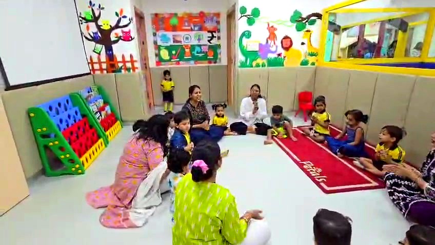 Teachers and children in circle time at Petals Preschool Sector 116 Noida